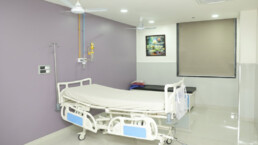 Clean hospital room with medical equipment.